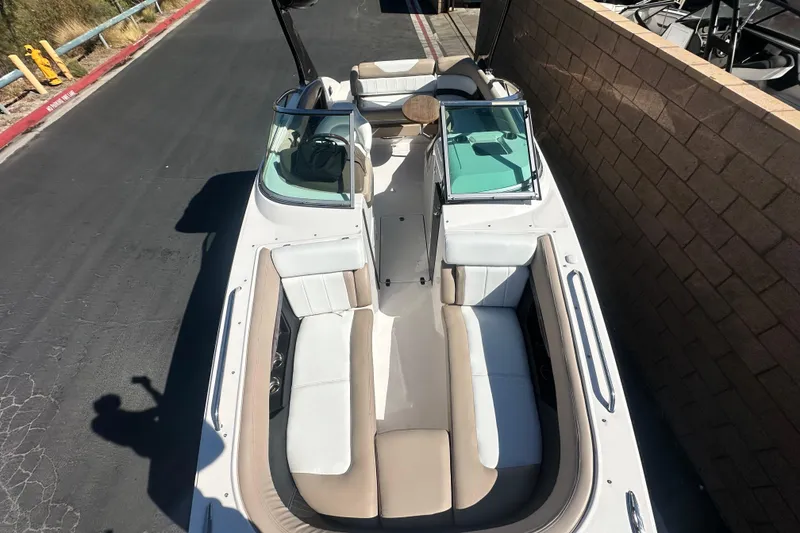 Slide: The Image of 2012 Regal 24 FasDeck boat interior with compact toilet and sink area. - 22