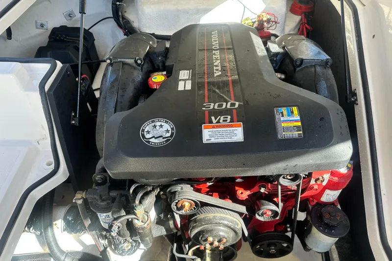 Slide: The Image of 2012 Regal 24 FasDeck capacity and safety labels with speaker on boat interior. - 26