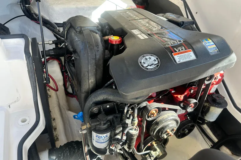 Slide: The Image of 2012 Regal 24 FasDeck boat hull identification number plate on blue surface. - 27