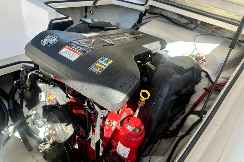 Slide: The Image of Trailer for 2012 Regal 24 FasDeck boat with dual axles and shiny wheels. - 28