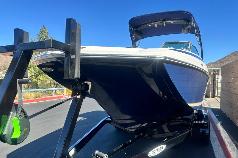 Slide: The Image of 2012 Regal 24 FasDeck boat interior with spacious seating and modern design. - 8