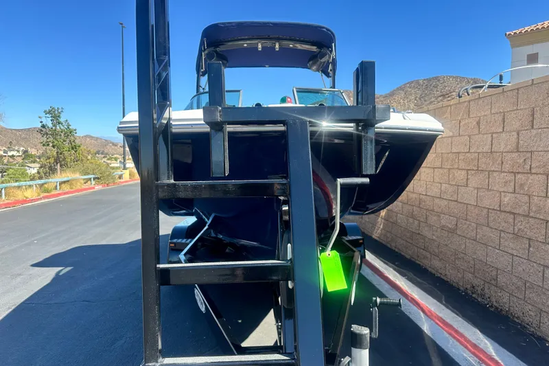 Slide: The Image of 2012 Regal 24 FasDeck boat with spacious seating and sleek design. - 9