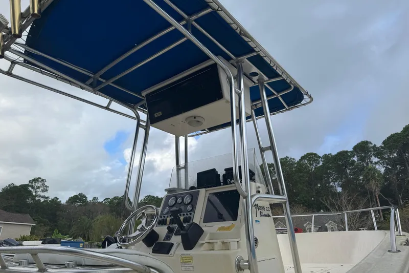 Slide: The Image of 2005 Key West 225 Center Console boat with blue canopy and control panel. - 14