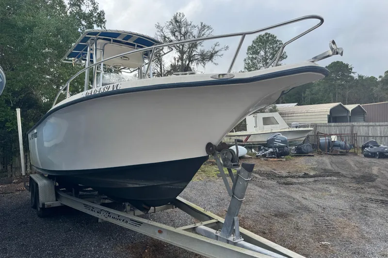 Slide: The Image of 2005 Key West 225 Center Console boat on trailer in outdoor storage area. - 8