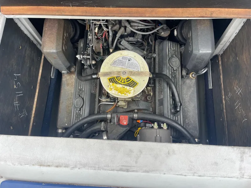 Slide: The Image of 1988 Regal boat engine compartment with visible components and wiring. - 16