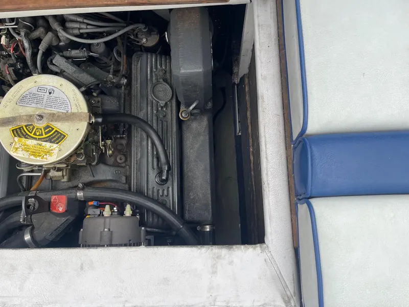Slide: The Image of 1988 Regal boat engine compartment with visible components and wiring. - 17