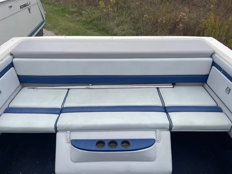 Slide: The Image of 1988 Regal boat interior with blue and white seating. - 5