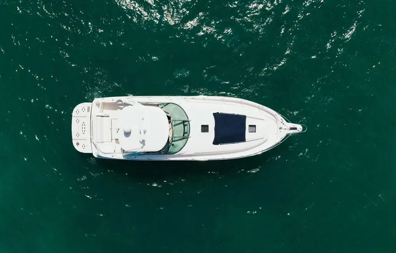Slide: The Image of Aerial view of 2004 Sea Ray 460 Sundancer yacht on open water. - 2