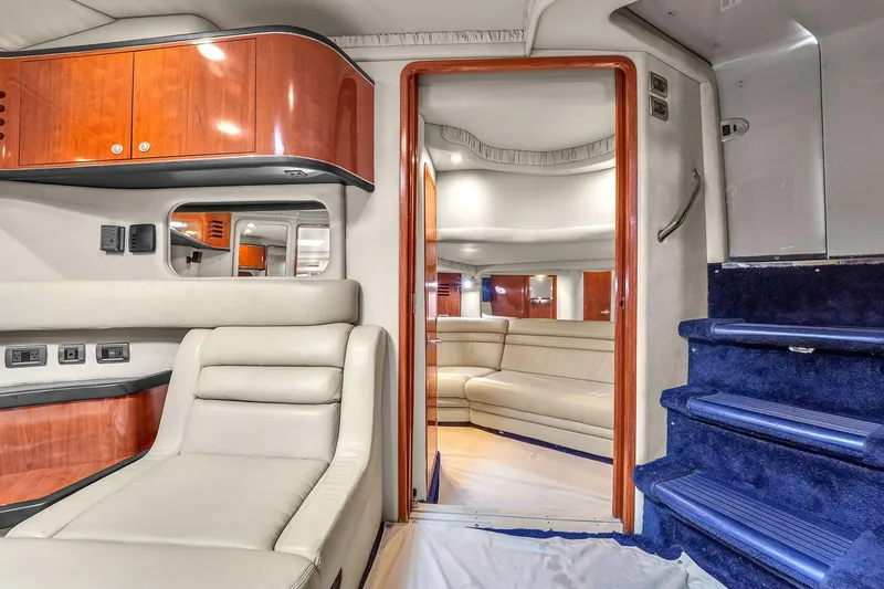 Slide: The Image of Luxurious interior of 2004 Sea Ray 460 Sundancer yacht with plush seating and elegant wood finishes. - 25