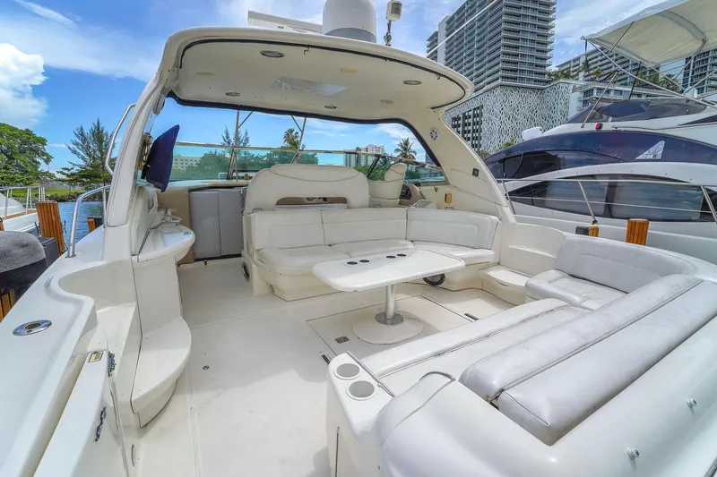 Slide: The Image of Luxurious 2004 Sea Ray 460 Sundancer yacht with spacious white seating and modern amenities. - 7