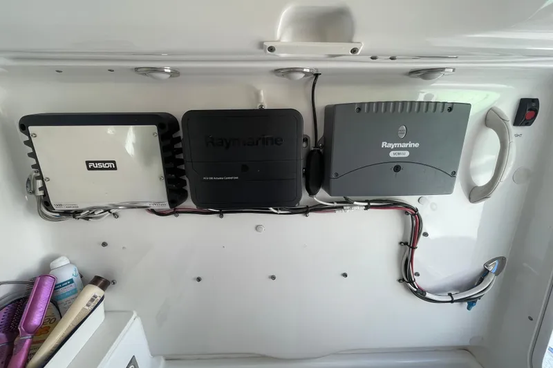 Slide: The Image of Electronics setup on 2008 Everglades 290 Center Console boat, featuring Raymarine and Fusion devices. - 13