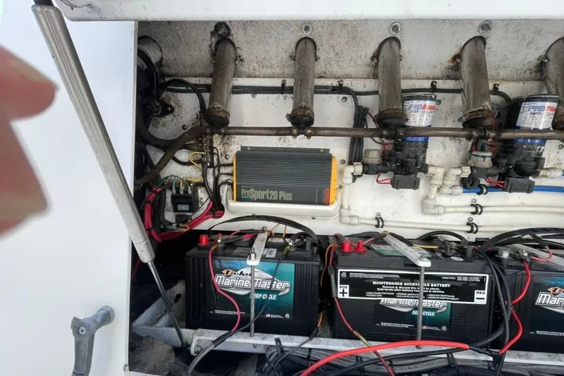 Slide: The Image of 2008 Everglades 290 Center Console battery compartment with ProSport20 Plus charger and Marine Master batteries. - 14
