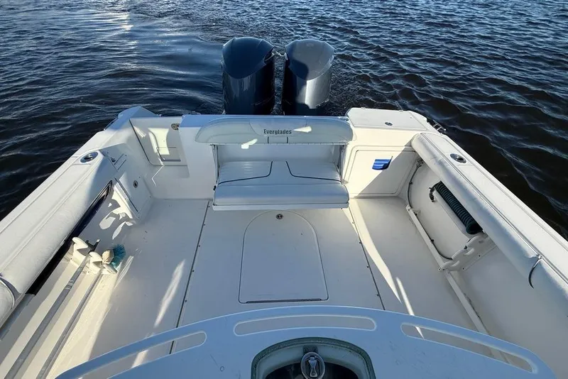 Slide: The Image of 2008 Everglades 290 Center Console boat interior with twin engines on water. - 2