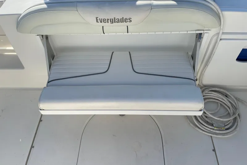 Slide: The Image of 2008 Everglades 290 Center Console boat seat with folded cushion and rope. - 3