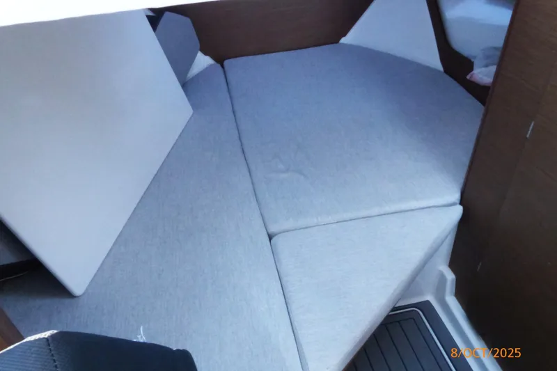 Slide: The Image of Interior of 2023 Jeanneau NC Weekender 795 Series 2, featuring modern seating and table. - 11