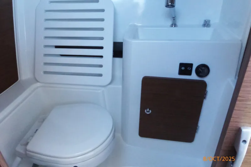 Slide: The Image of Interior view of 2023 Jeanneau NC Weekender 795 Series 2 boat with sunroof and windshield. - 13