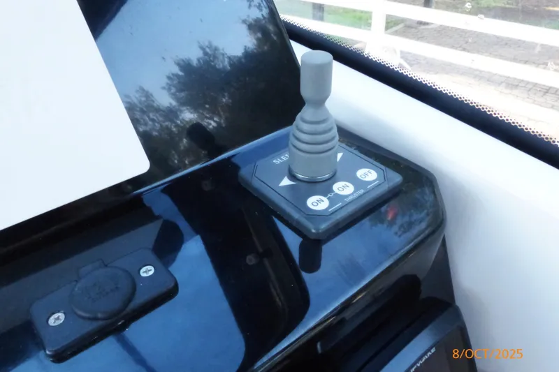 Slide: The Image of Interior cabin of 2023 Jeanneau NC Weekender 795 Series 2 with gray cushions. - 14