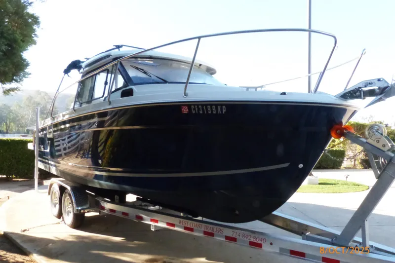 Slide: The Image of Interior storage of 2023 Jeanneau NC Weekender 795 Series 2 with blue container. - 19