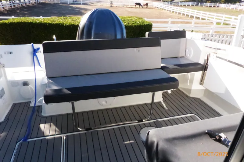 Slide: The Image of 2023 Jeanneau NC Weekender 795 Series 2 boat interior with seating and table. - 2