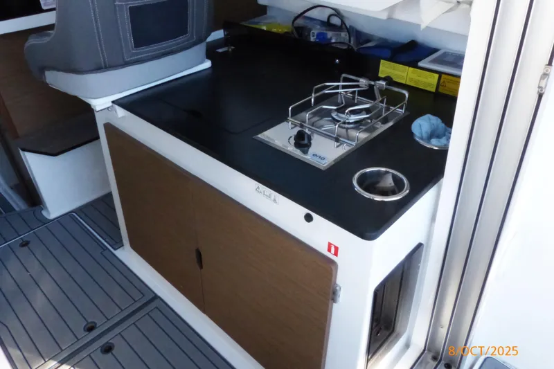 Slide: The Image of Helm of 2023 Jeanneau NC Weekender 795 Series 2 with Garmin display and controls. - 6