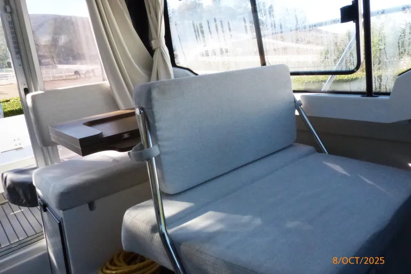 Slide: The Image of 2023 Jeanneau NC Weekender 795 Series 2 interior with seating and table. - 8