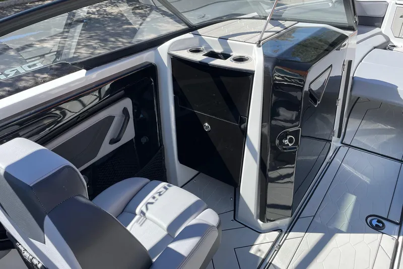 Slide: The Image of 2025 Yamaha Boats 255XD interior with sleek seating and modern console design. - 10