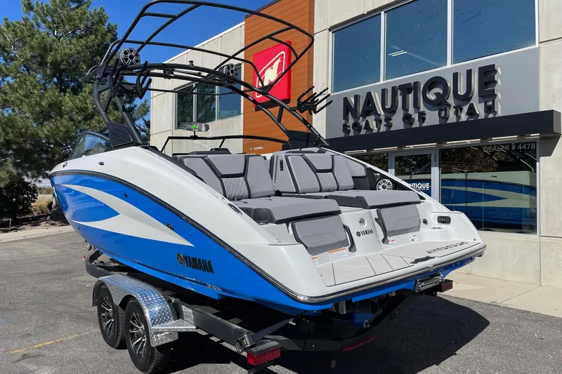 Slide: The Image of 2025 Yamaha Boats 255XD displayed outside Nautique dealership in Utah. - 3