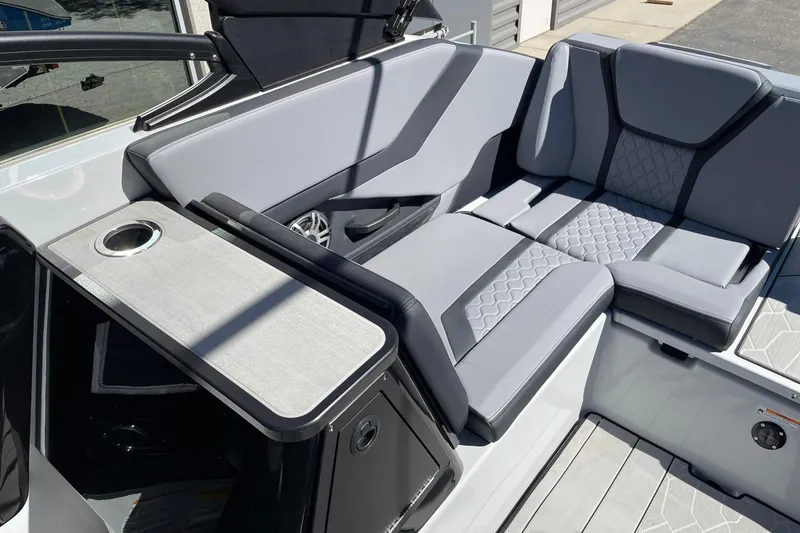 Slide: The Image of 2025 Yamaha Boats 255XD interior with sleek gray seating and modern design. - 7