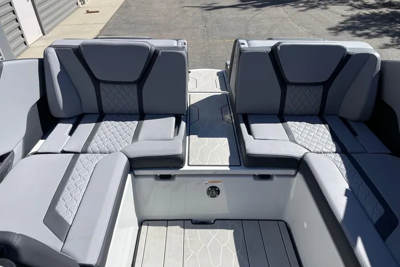 Slide: The Image of 2025 Yamaha Boats 255XD interior seating with modern gray upholstery design. - 8