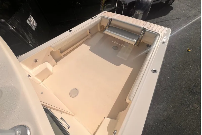 Slide: The Image of 2007 Parker 2320 SL Sport Cabin boat deck with seating and storage. - 2