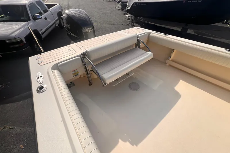 Slide: The Image of 2007 Parker 2320 SL Sport Cabin boat with Yamaha 250 engine, docked near a white truck. - 7