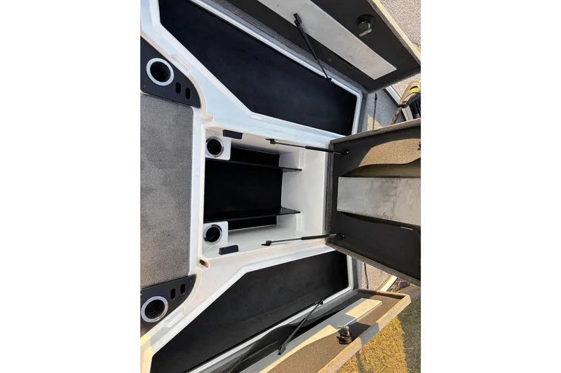 Slide: The Image of 2016 Nitro Z18 Pro boat on trailer by a lake under clear blue sky. - 11