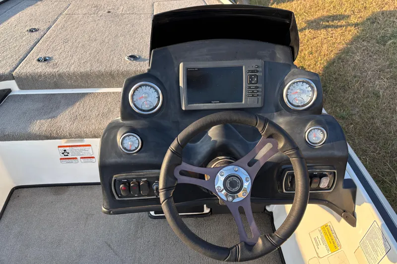 Slide: The Image of Rear view of a 2016 Nitro Z18 boat with an outboard motor on a trailer. - 12