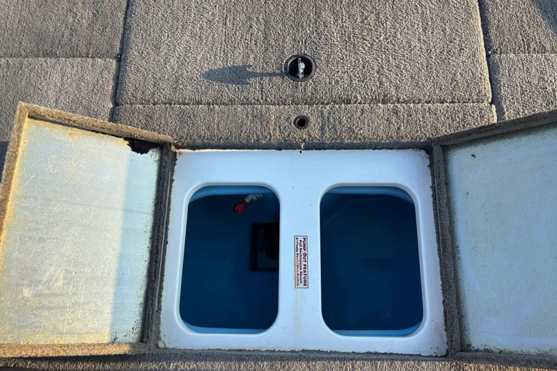 Slide: The Image of 2016 Nitro Z18 boat motor propeller on pavement, close-up view. - 15