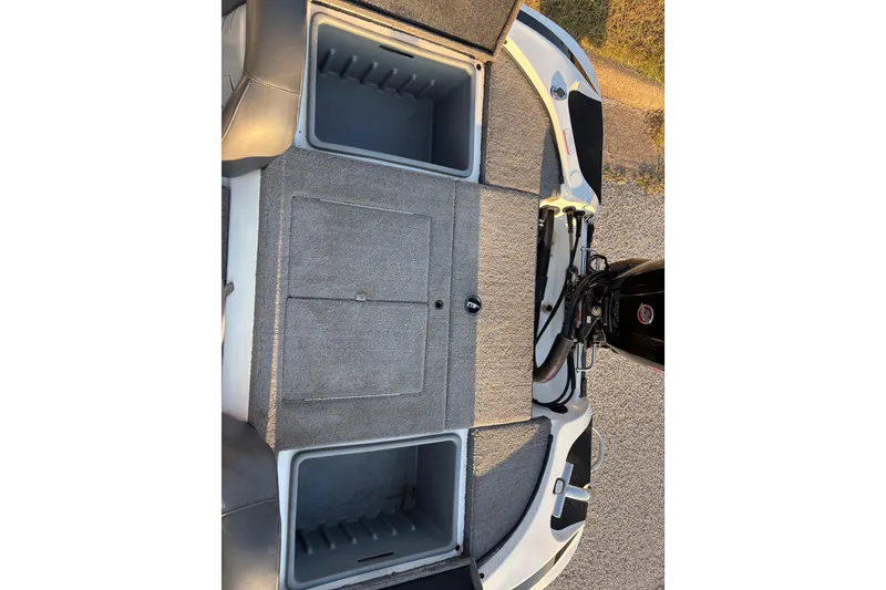 Slide: The Image of 2016 Nitro Z18 boat storage compartments open, showcasing spacious interior design. - 17