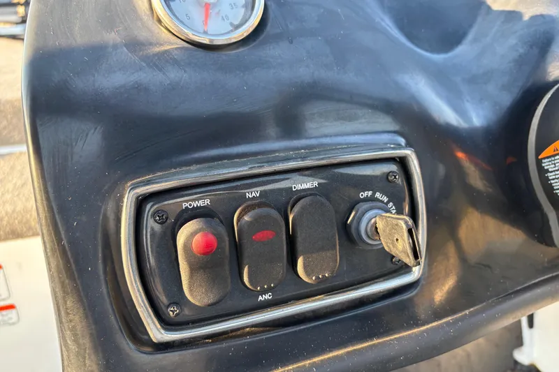 Slide: The Image of 2016 Nitro Z18 Pro boat on trailer by a lakeside dock. - 19