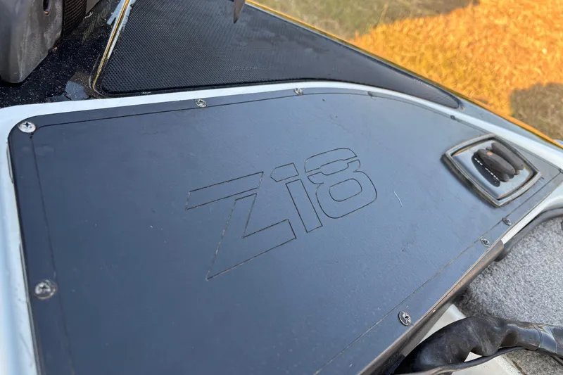 Slide: The Image of 2016 Nitro Z18 Pro boat on trailer, parked outdoors under clear sky. - 22