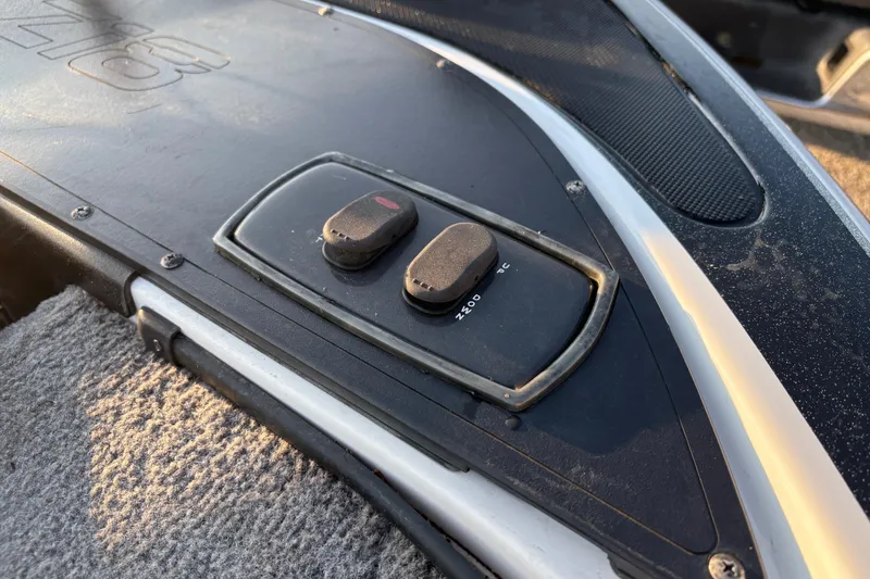 Slide: The Image of 2016 Nitro Z18 Pro boat on trailer by the water. - 23