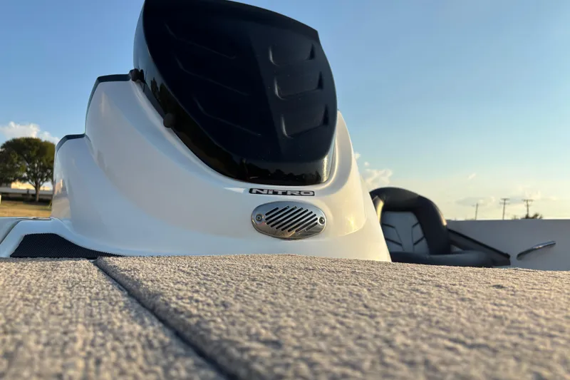 Slide: The Image of 2016 Nitro Z18 Pro boat on trailer by the water. - 24