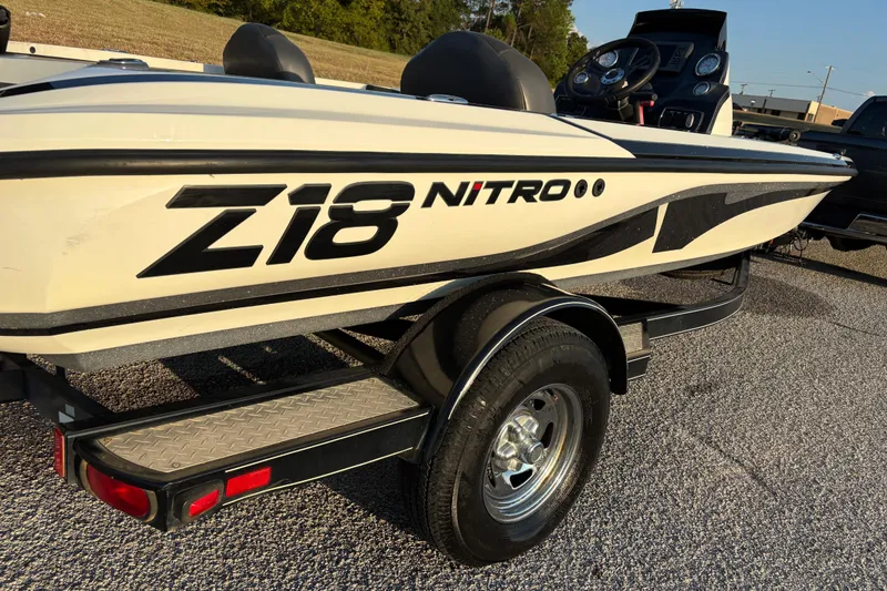 Slide: The Image of 2016 Nitro Z18 Pro boat on trailer by the water. - 26