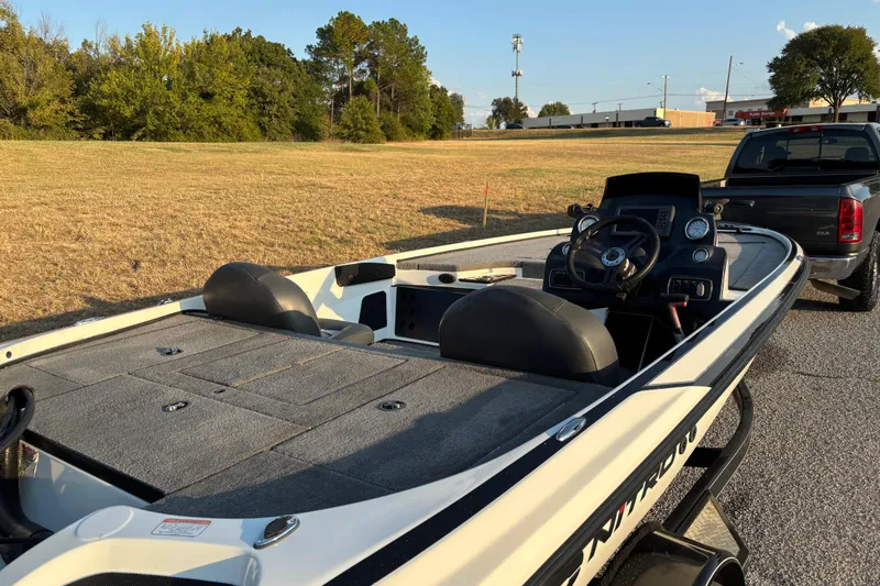 Slide: The Image of 2016 Nitro Z18 Pro boat on trailer, parked outdoors under clear sky. - 27