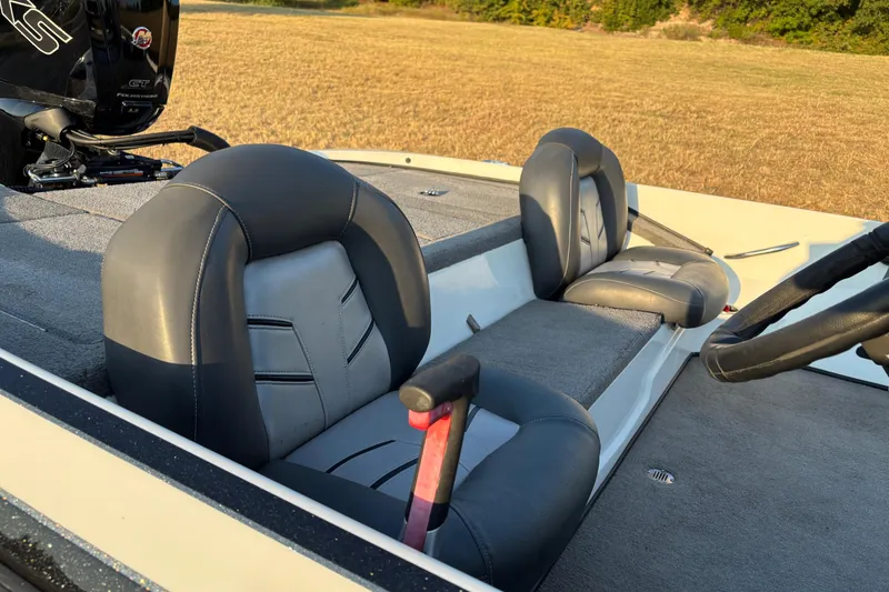 Slide: The Image of 2016 Nitro Z18 Pro boat on trailer by lakeside, featuring powerful outboard motor. - 28