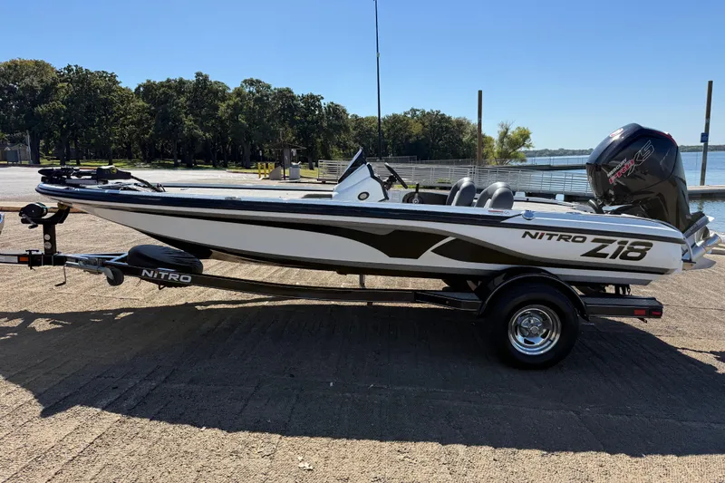 Slide: The Image of Open storage compartment on a 2016 Nitro Z18 boat deck. - 35