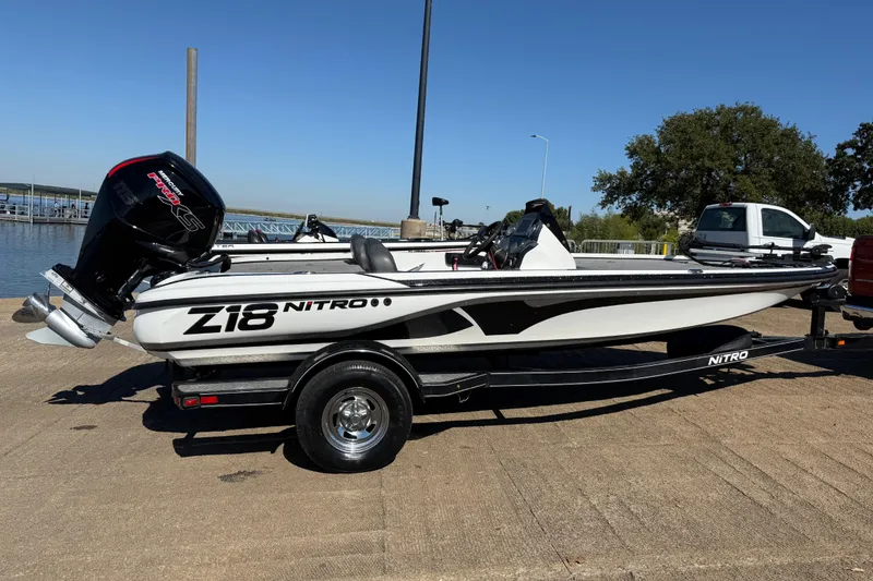 Slide: The Image of Mercury 115 Pro outboard motor on 2016 Nitro Z18 boat, sunny day background. - 44