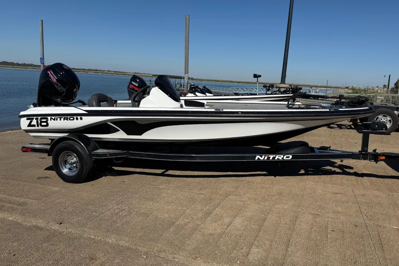 Slide: The Image of Control panel of a 2016 Nitro Z18 boat with switches and ignition key. - 46