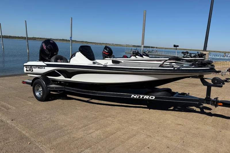 Slide: The Image of Trailer of a 2016 Nitro Z18 boat with spare tire on gravel. - 47
