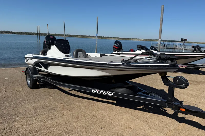 Slide: The Image of 2016 Nitro Z18 Pro boat on a ramp by a lake, ready for launch. - 48