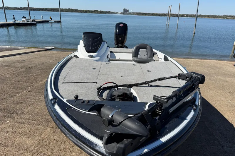 Slide: The Image of Boat docked by the lake, featuring a 2016 Nitro Z18 Pro with Mercury engine. - 51