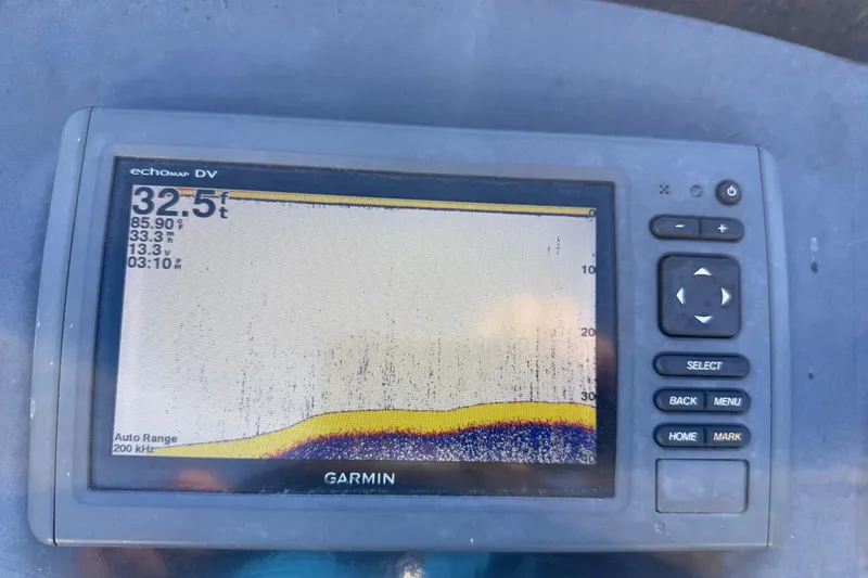 Slide: The Image of Shiny propeller of a 2016 Nitro Z18 Pro boat on a workshop floor. - 68