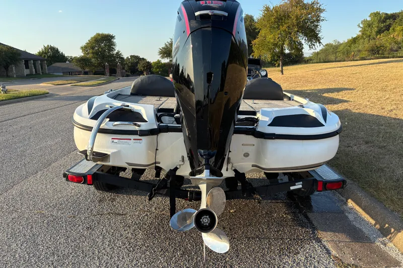 Slide: The Image of 2016 Nitro Z18 Pro boat on trailer, parked outdoors under clear blue sky. - 7